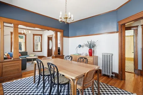 a view of a a dining room with furniture window and outside view