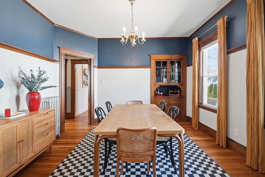 42 Lagrange Street, Unit U1 Boston, MA 02132 - Photo 17 of 42 a hallway has a chandelier and a dining table view