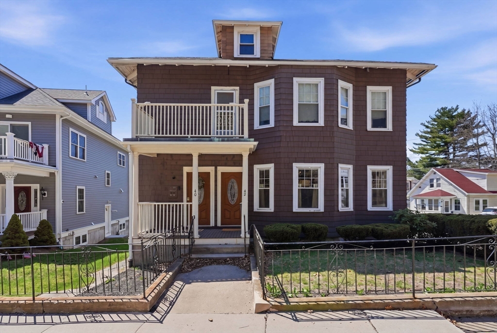 42 Lagrange Street, Unit U1 Boston, MA 02132 - Photo 2 of 42 a front view of a house with a yard
