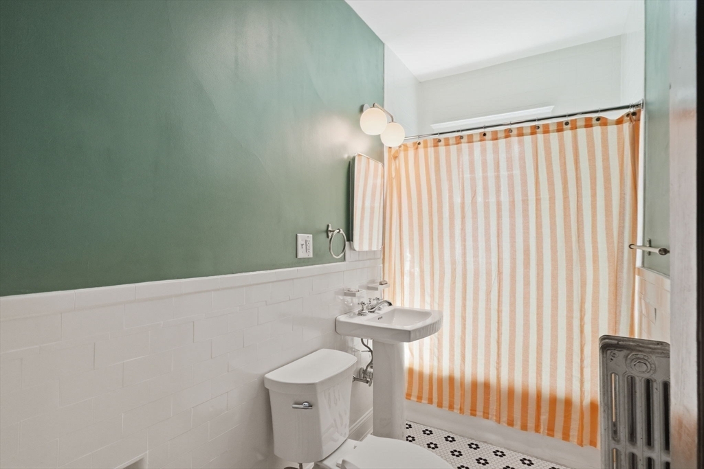 42 Lagrange Street, Unit U1 Boston, MA 02132 - Photo 21 of 42 a bathroom with a sink a toilet and shower
