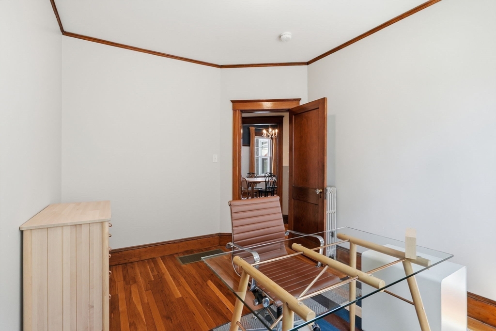 42 Lagrange Street, Unit U1 Boston, MA 02132 - Photo 22 of 42 a room with a bench and potted plant