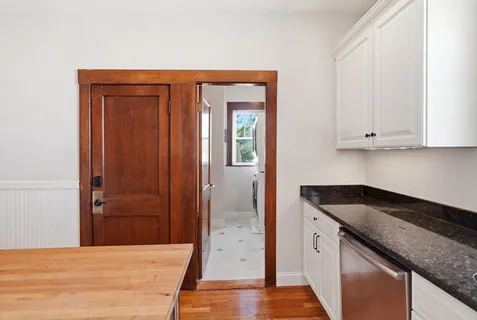 a kitchen with granite countertop cabinets and sink