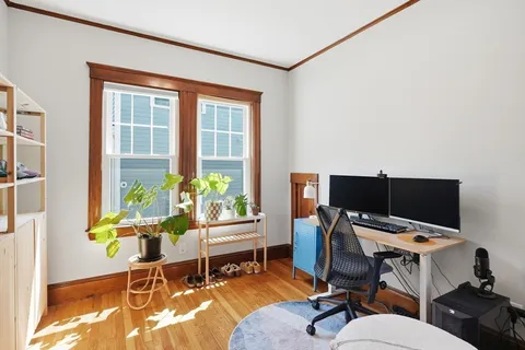 a workspace with furniture and a window