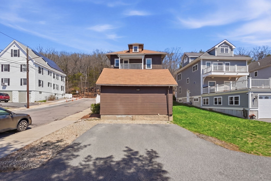 42 Lagrange Street, Unit U1 Boston, MA 02132 - Photo 32 of 42 a front view of a house with a yard