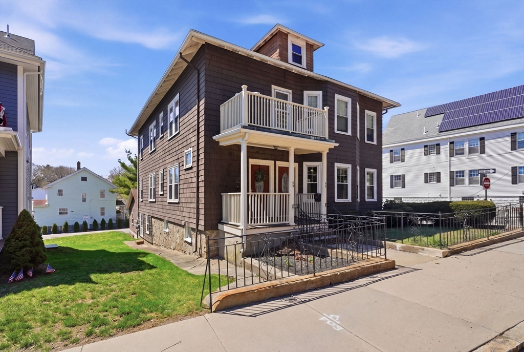 42 Lagrange Street, Unit U1 Boston, MA 02132 - Photo 34 of 42 a front view of a house with a yard