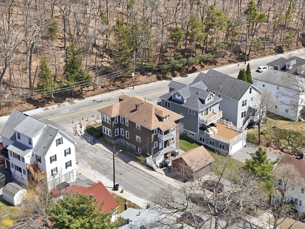 42 Lagrange Street, Unit U1 Boston, MA 02132 - Photo 37 of 42 an aerial view of a house with large trees