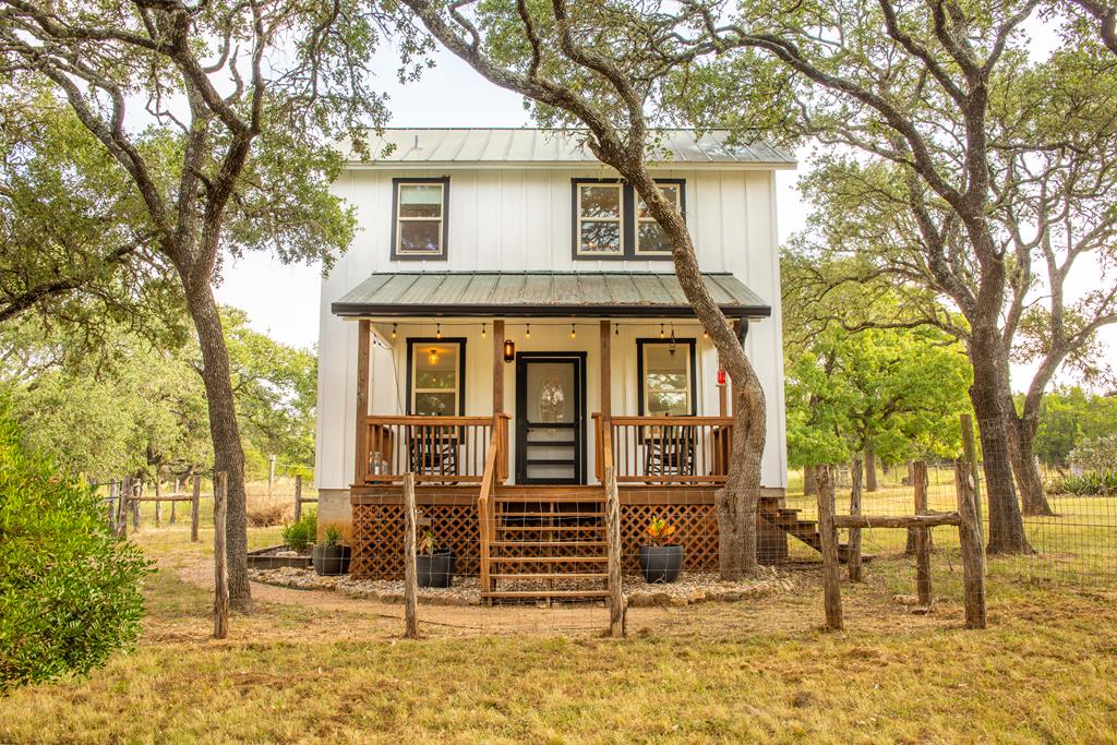 396 Ranch Road 2721 Johnson City, TX 78636 - Photo 1 of 1 front view of a house with a trees