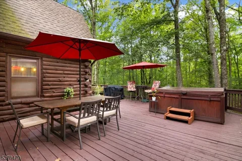 a view of a table and chairs in patio of the house