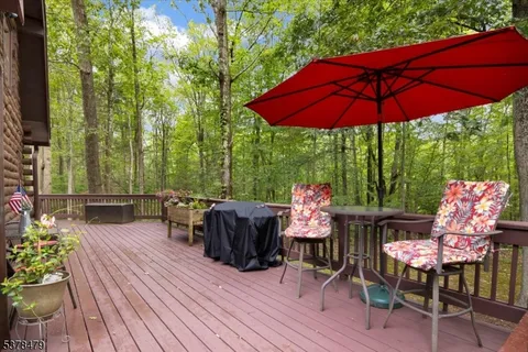 a view of balcony with furniture and wooden deck