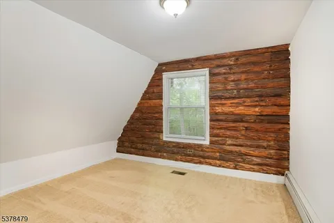 a bathroom with a double vanity sink toilet and a mirror