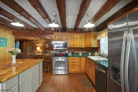a kitchen with lots of counter top space and stainless steel appliances