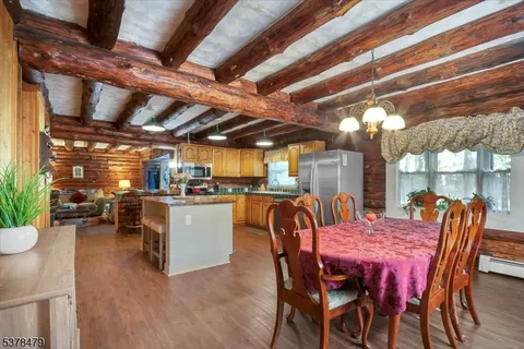 a dining room with a table and chairs
