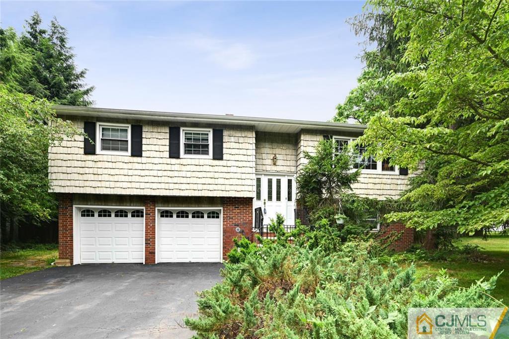 4 Revock Road East Brunswick, NJ 08816 - Photo 2 of 28 a front view of a house with garage