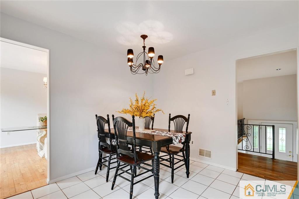 4 Revock Road East Brunswick, NJ 08816 - Photo 14 of 28 a view of a dining room with furniture and chandelier