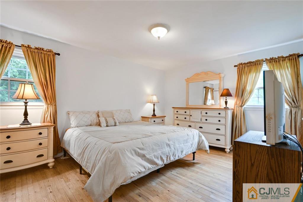 4 Revock Road East Brunswick, NJ 08816 - Photo 16 of 28 a bedroom with a bed and a large window