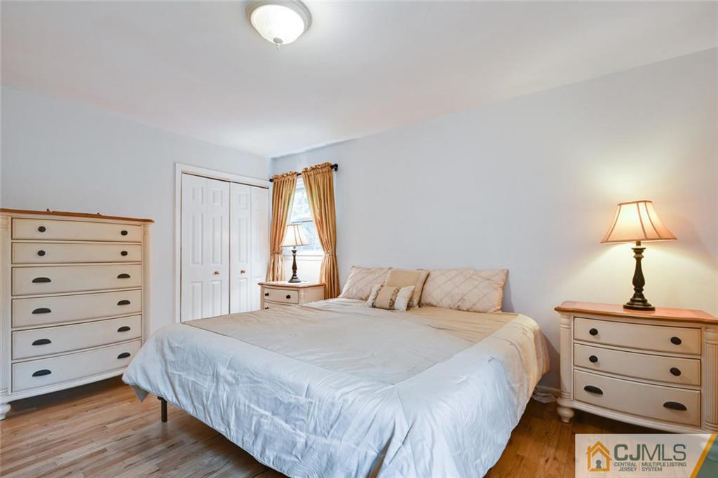 4 Revock Road East Brunswick, NJ 08816 - Photo 17 of 28 a bedroom with a bed and a dresser