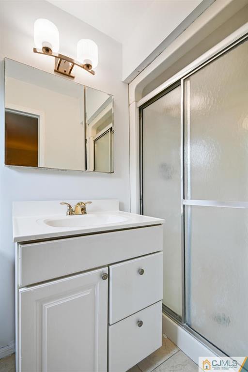 4 Revock Road East Brunswick, NJ 08816 - Photo 18 of 28 a bathroom with a sink and a mirror