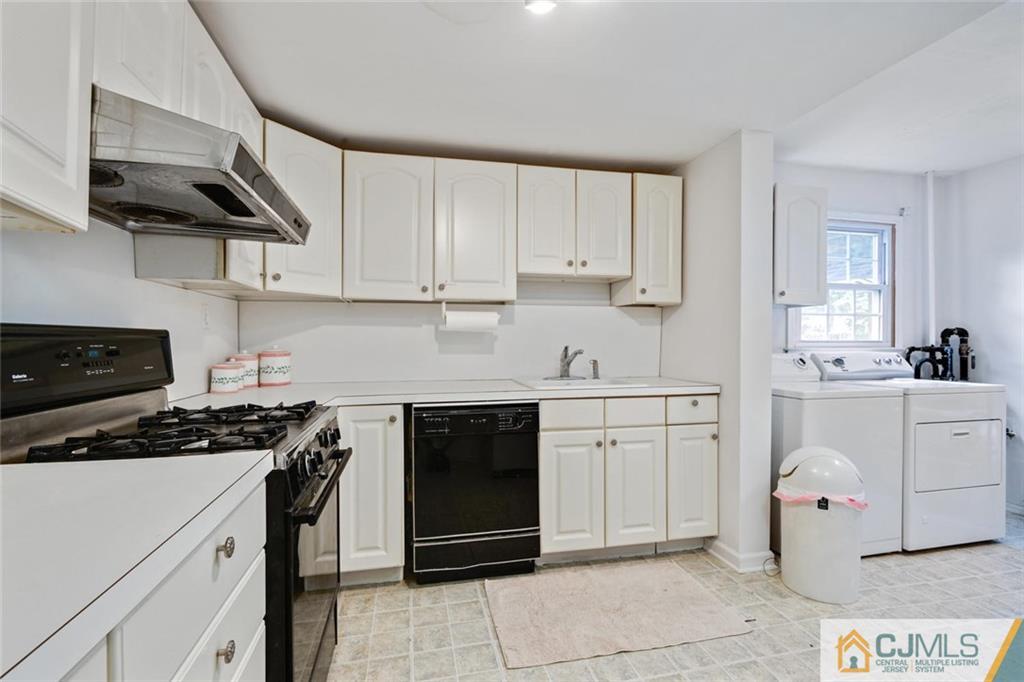 4 Revock Road East Brunswick, NJ 08816 - Photo 24 of 28 a kitchen with cabinets appliances a sink and a counter top