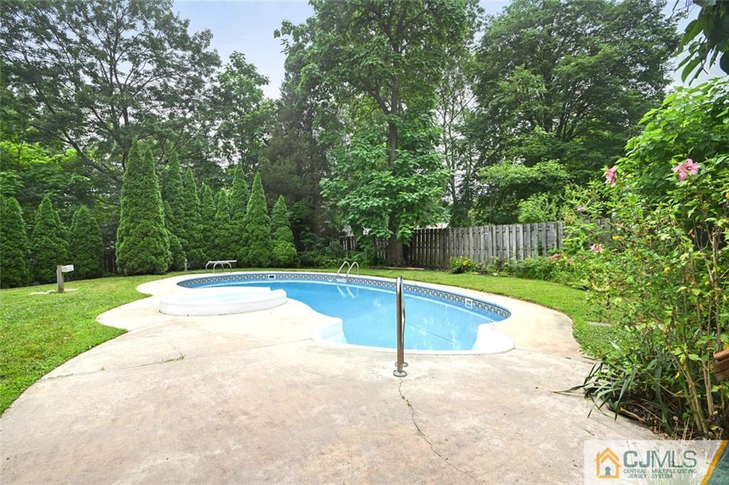4 Revock Road East Brunswick, NJ 08816 - Photo 26 of 28 a view of a swimming pool with a yard