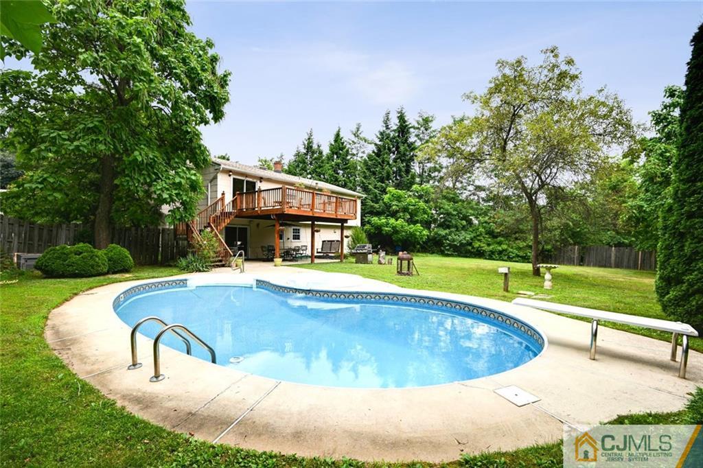 4 Revock Road East Brunswick, NJ 08816 - Photo 27 of 28 a view of a swimming pool with a yard