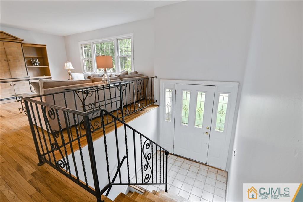 4 Revock Road East Brunswick, NJ 08816 - Photo 6 of 28 a view of an entryway with wooden floor and windows