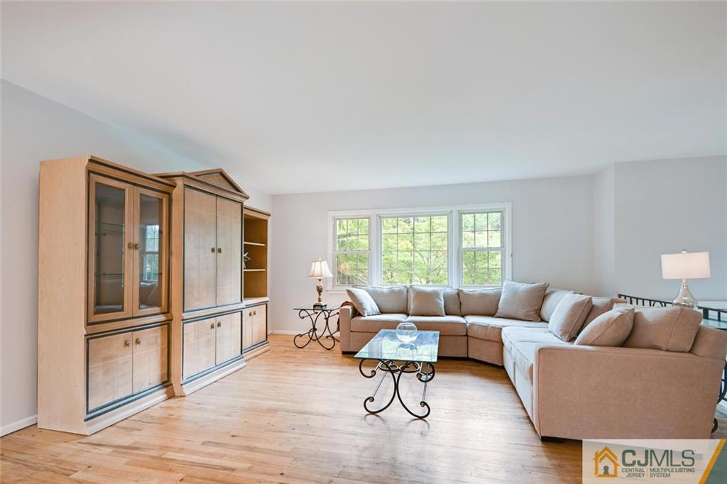 4 Revock Road East Brunswick, NJ 08816 - Photo 9 of 28 a living room with furniture and a large window