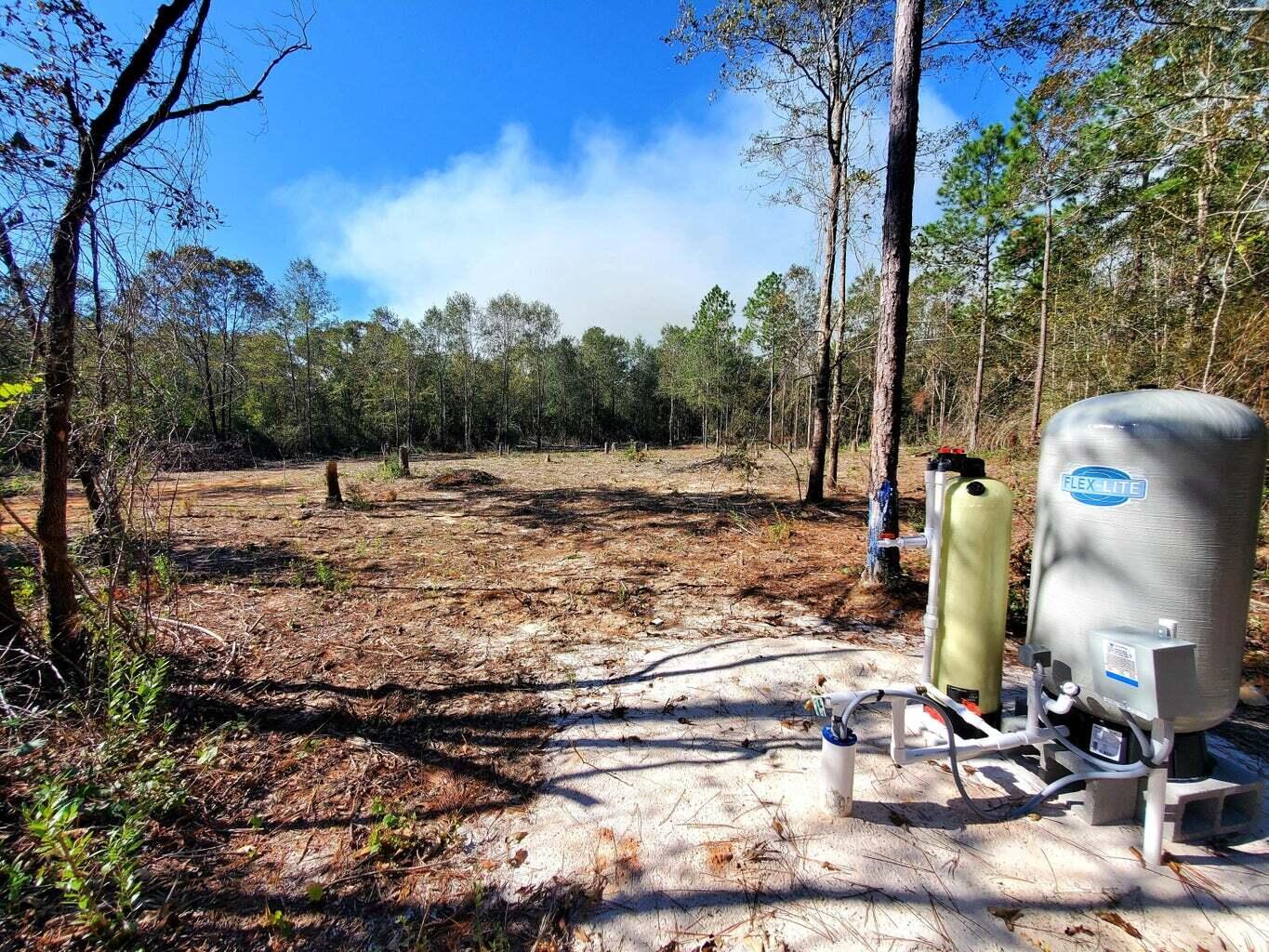 6221 County Line Road Baker, FL 32531 - Photo 11 of 16 a view of a yard with an empty space
