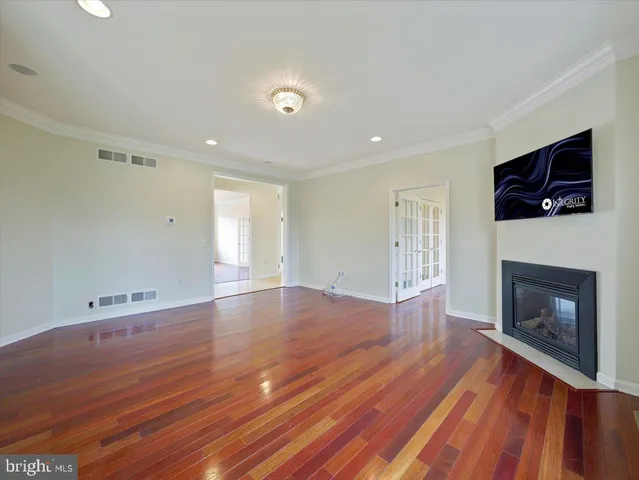 a large room with a large window and kitchen view