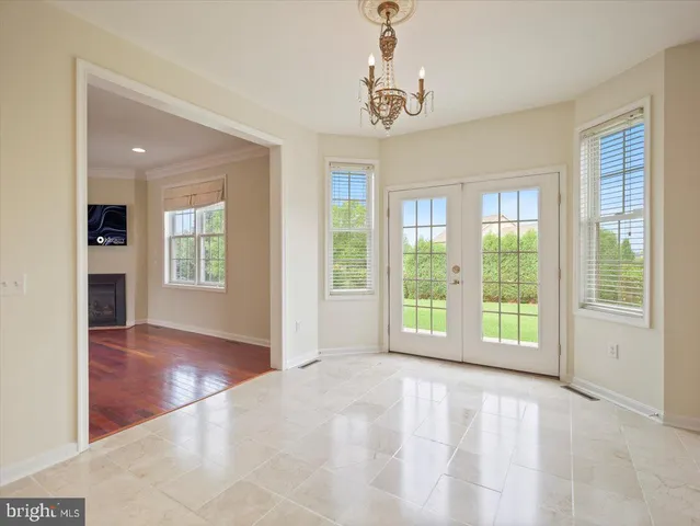 a kitchen with stainless steel appliances granite countertop a kitchen island a stove and a sink