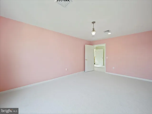 a view of a room with a large window