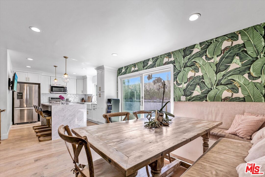 5101 Keli Court Los Angeles, CA 90066 - Photo 13 of 29 a view of a dining room with furniture and a floor to ceiling window