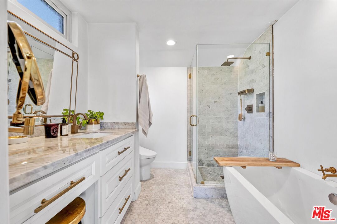 5101 Keli Court Los Angeles, CA 90066 - Photo 23 of 29 a bathroom with a granite countertop tub sink toilet and shower