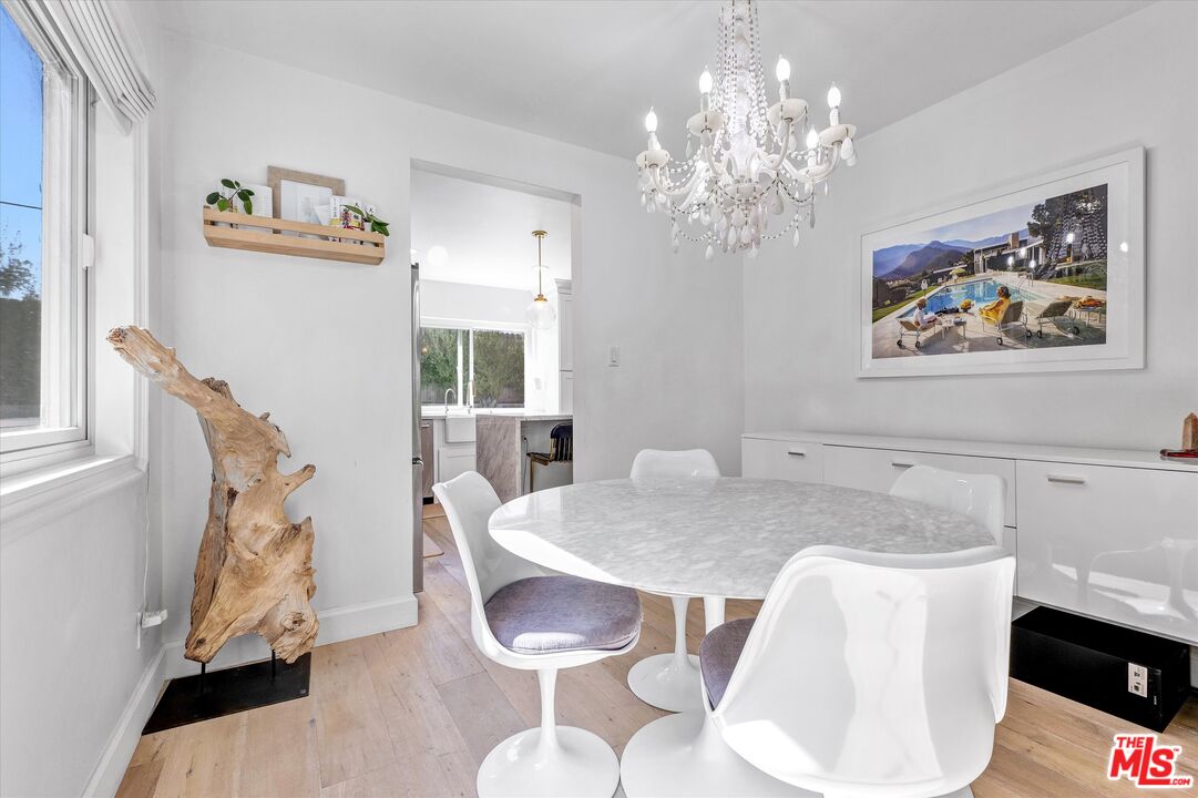 5101 Keli Court Los Angeles, CA 90066 - Photo 4 of 29 a view of a dining room with furniture and wooden floor