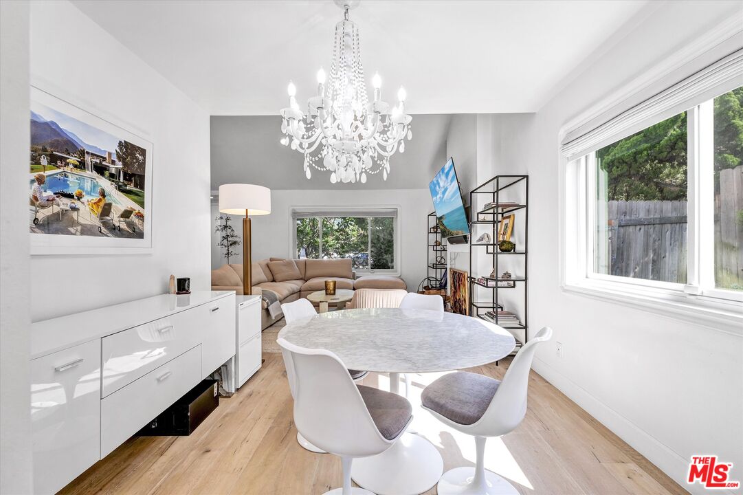 5101 Keli Court Los Angeles, CA 90066 - Photo 5 of 29 a view of a dining room with furniture a chandelier and window