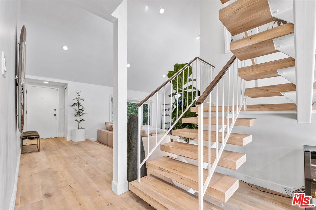 5101 Keli Court Los Angeles, CA 90066 - Photo 6 of 29 a view of staircase with white walls and railing