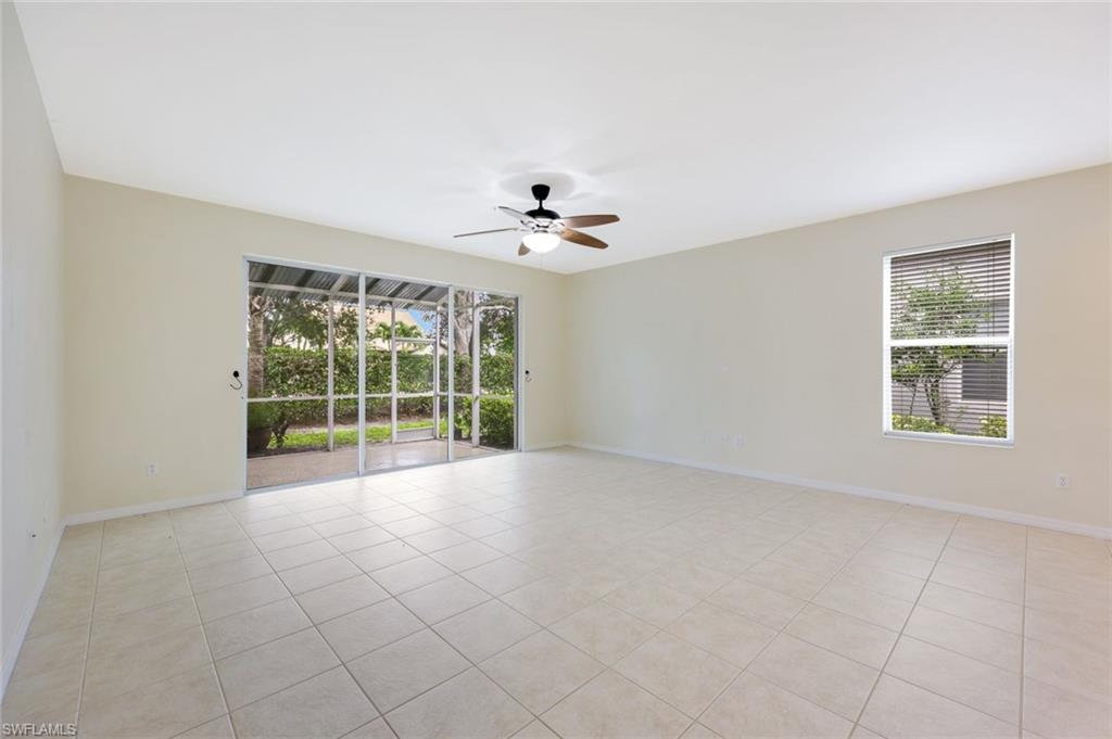 16162 Ravina Way, Unit 65 Naples, FL 34110 - Photo 11 of 22 a view of an empty room with a window