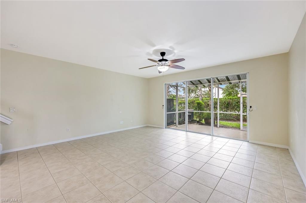 16162 Ravina Way, Unit 65 Naples, FL 34110 - Photo 2 of 22 a view of an empty room with a window