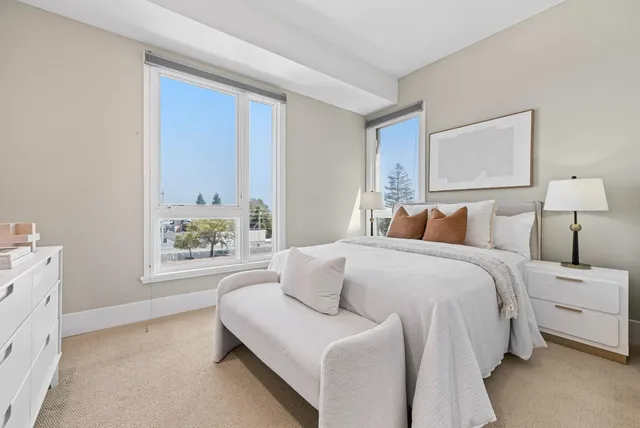 a bedroom with bed and window