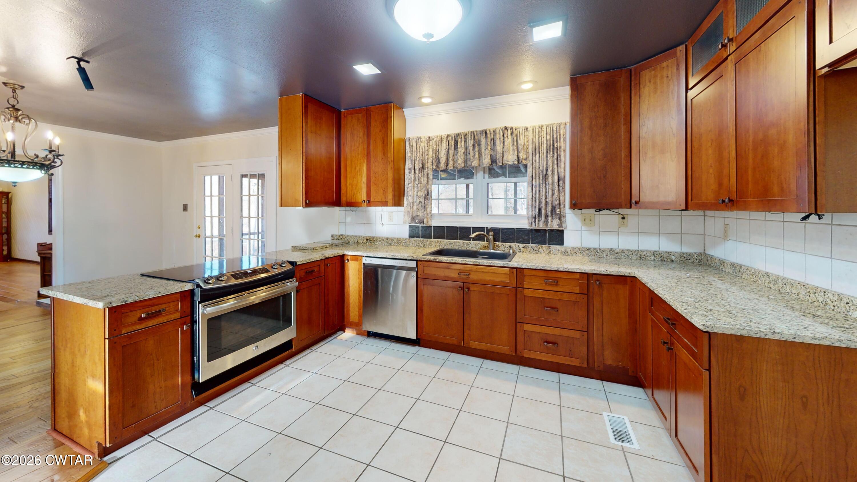 44 Pine Ridge Road Dyersburg, TN 38024 - Photo 26 of 41 44-Pine-Ridge-Cove-Kitchen 1