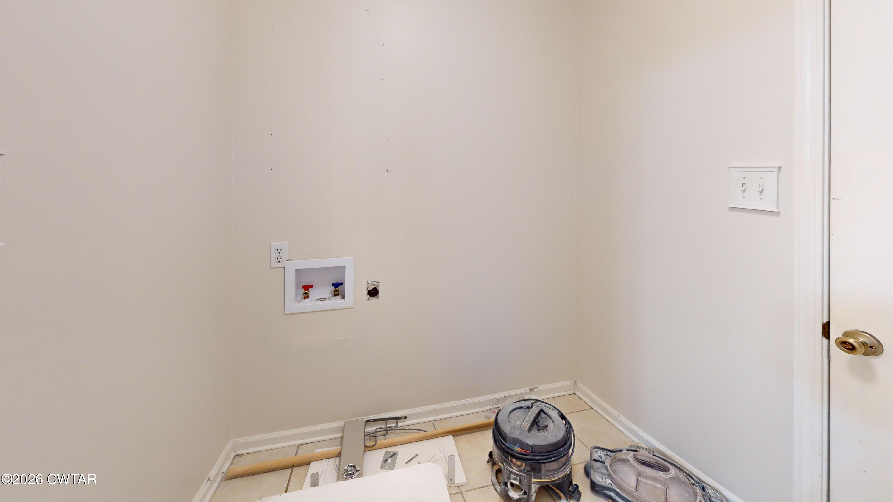 44 Pine Ridge Road Dyersburg, TN 38024 - Photo 28 of 41 44-Pine-Ridge-Cove-Laundry