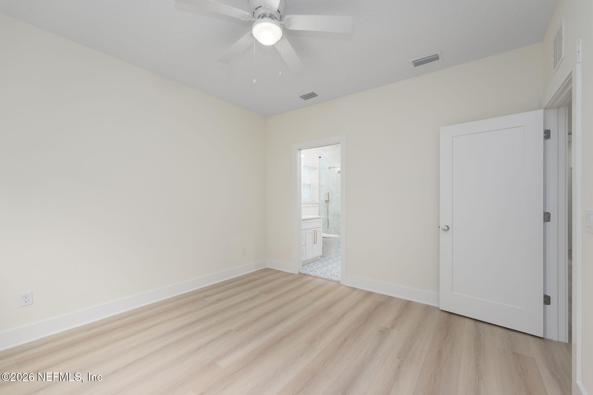 688 Madeore Street St. Augustine, FL 32084 - Photo 13 of 28 a view of a room with wooden floor and fan