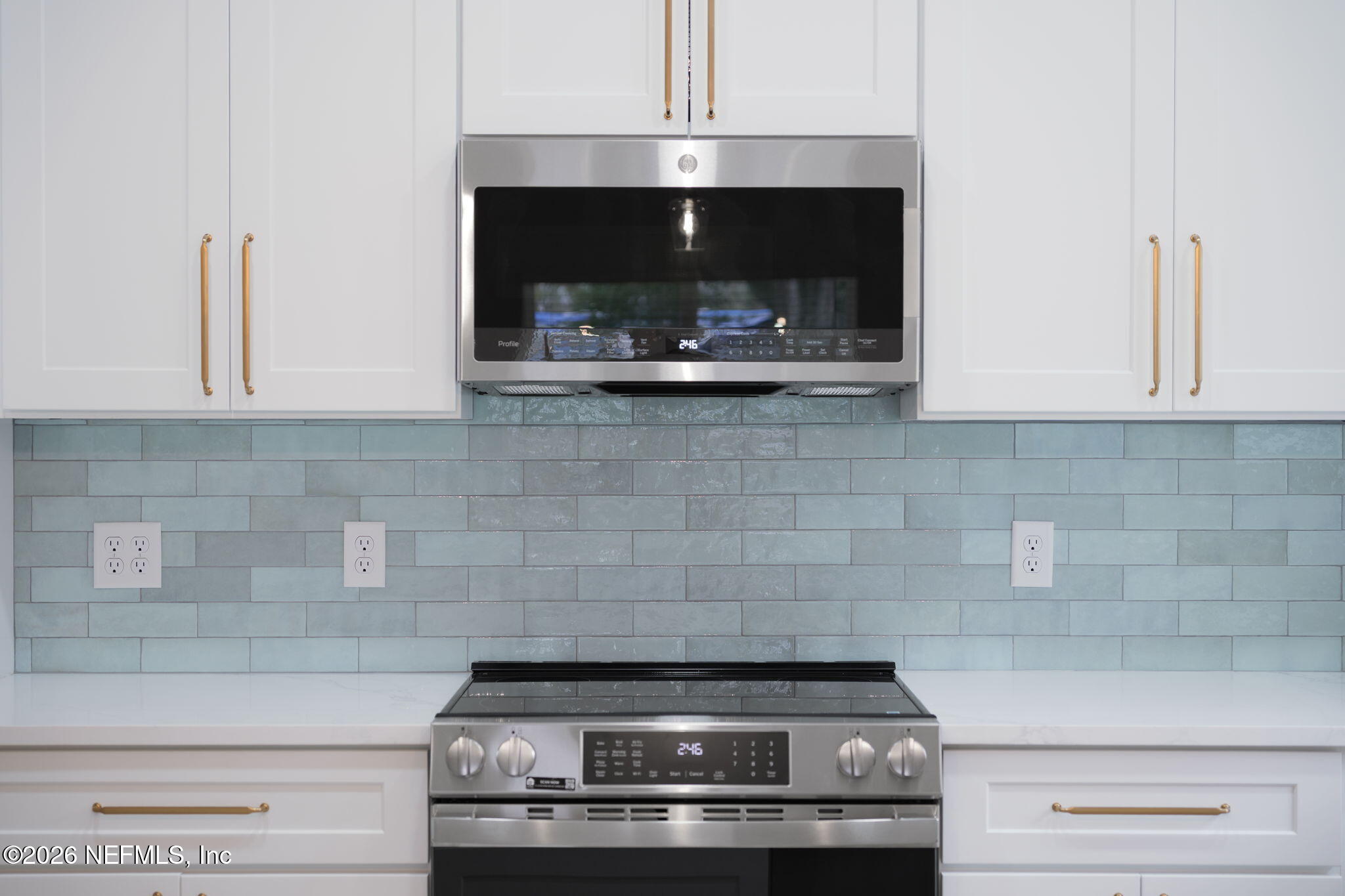 688 Madeore Street St. Augustine, FL 32084 - Photo 10 of 28 a stove top oven sitting inside of a kitchen