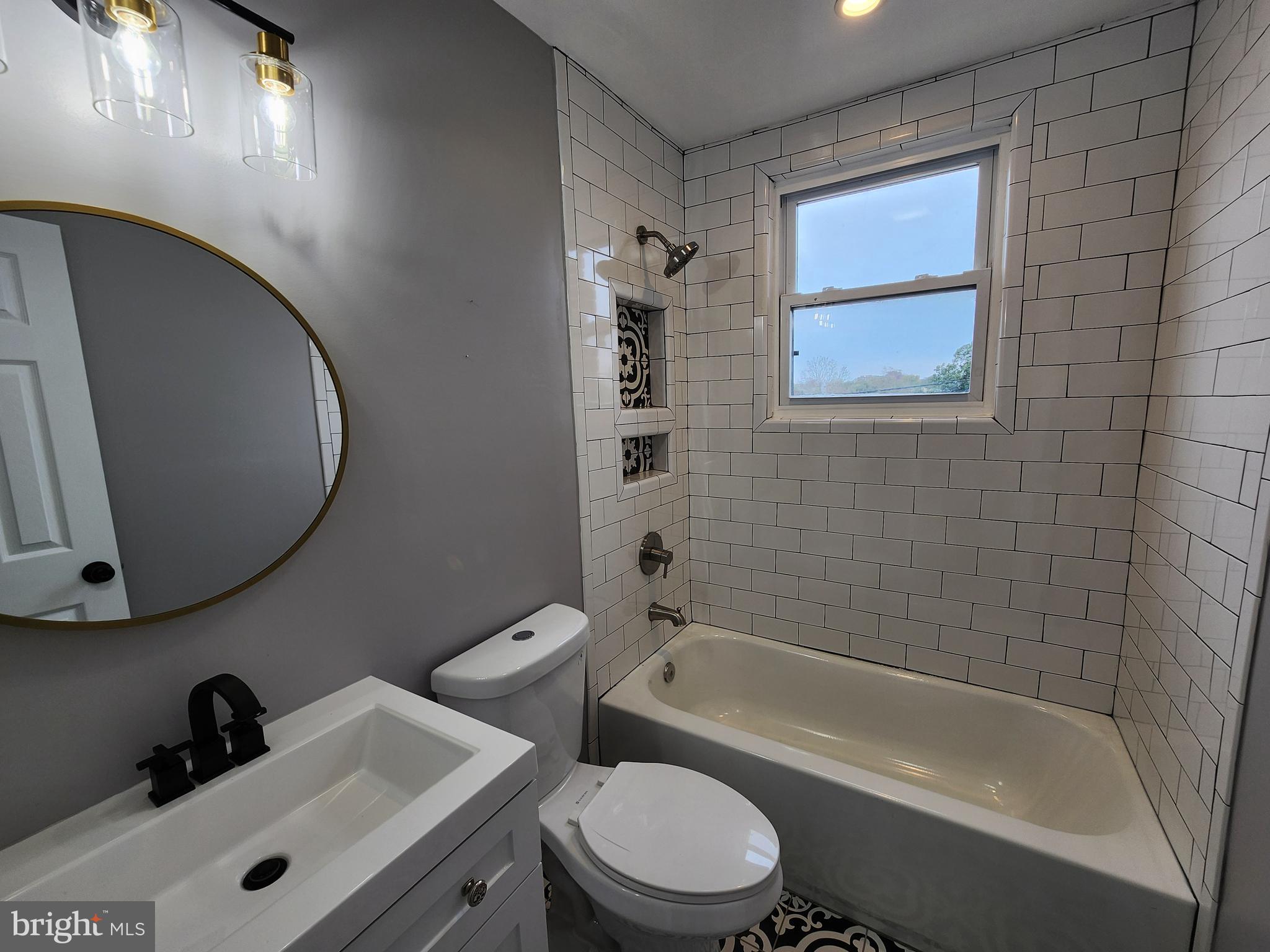 1261 Gallatin Street Northeast Washington, DC 20017 - Photo 22 of 60 a bathroom with a sink a toilet and bathtub
