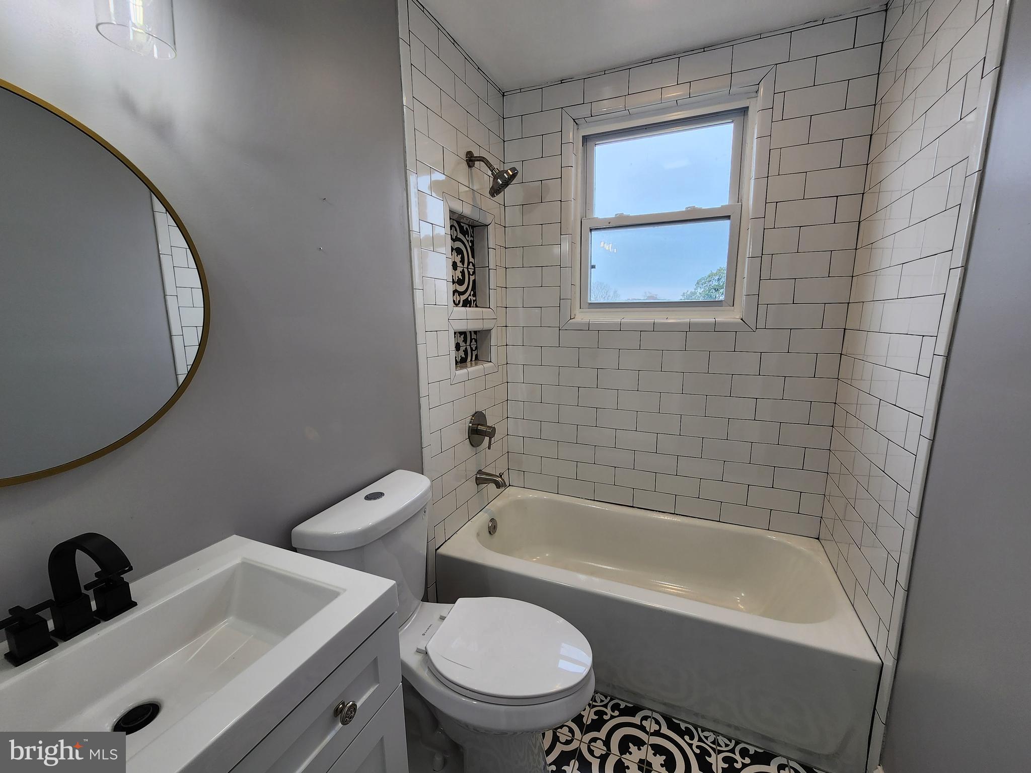 1261 Gallatin Street Northeast Washington, DC 20017 - Photo 23 of 60 a bathroom with a sink a toilet and shower