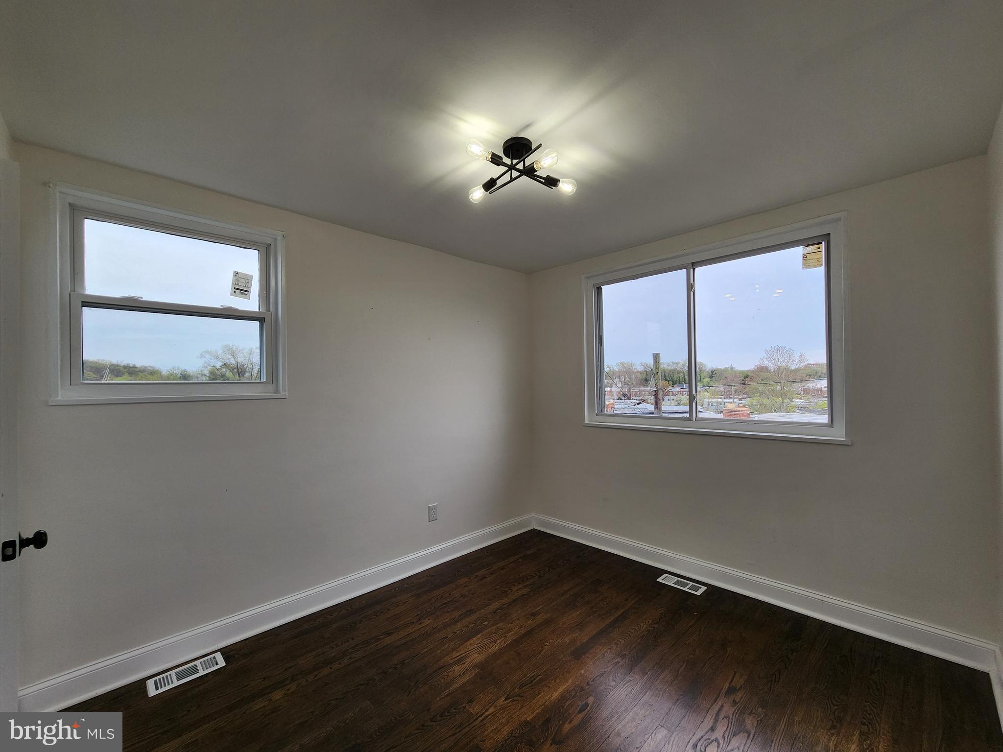 1261 Gallatin Street Northeast Washington, DC 20017 - Photo 25 of 60 a view of wooden floor chandelier and window in a room