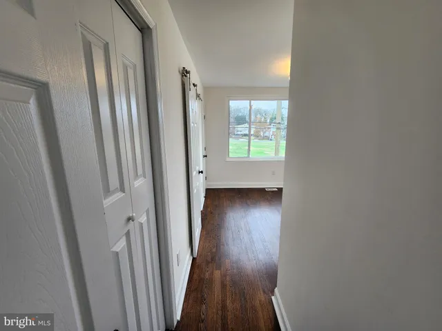 a view of front door with chair and door