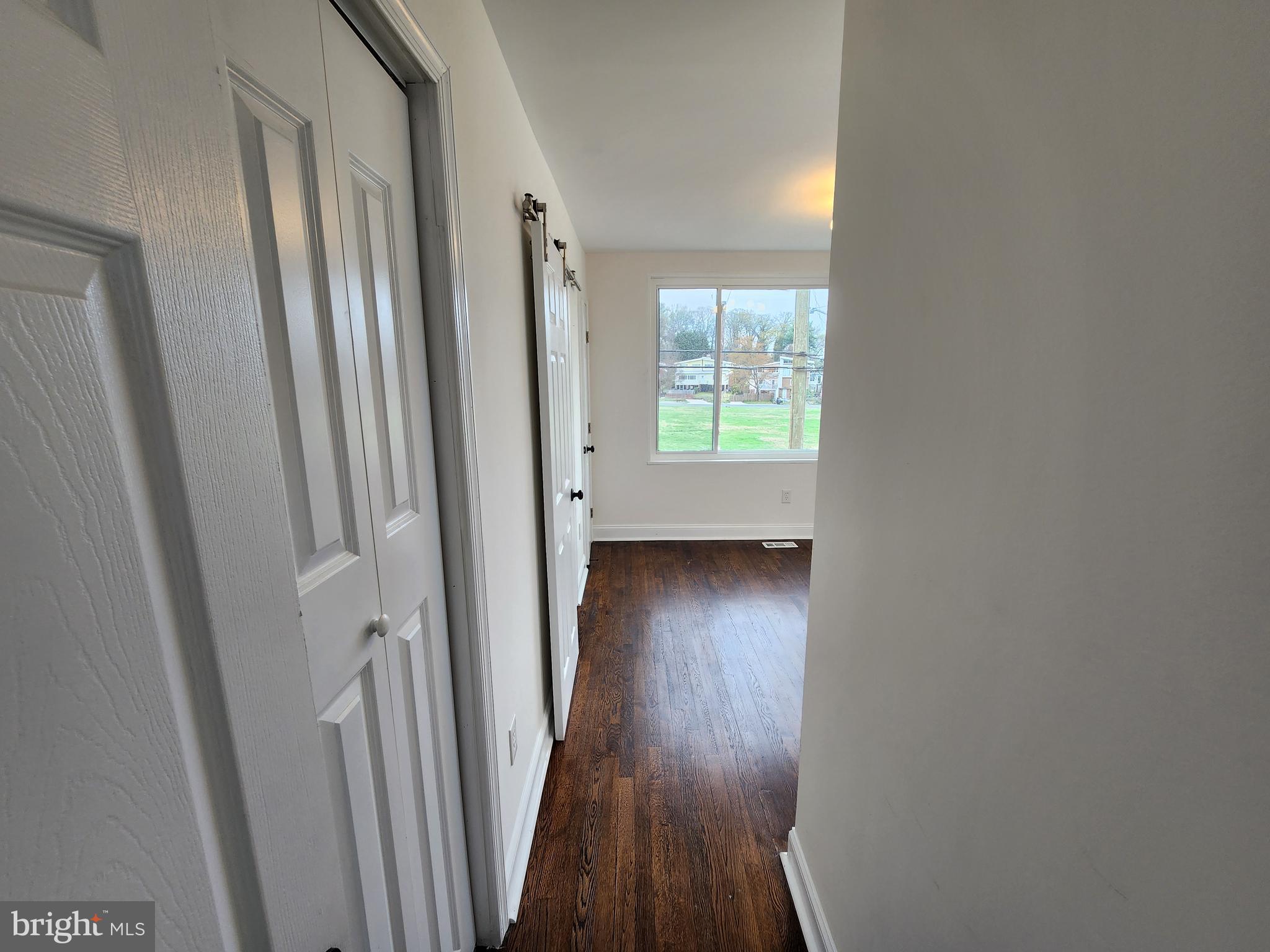 1261 Gallatin Street Northeast Washington, DC 20017 - Photo 26 of 60 a view of a hallway with wooden floor and a window