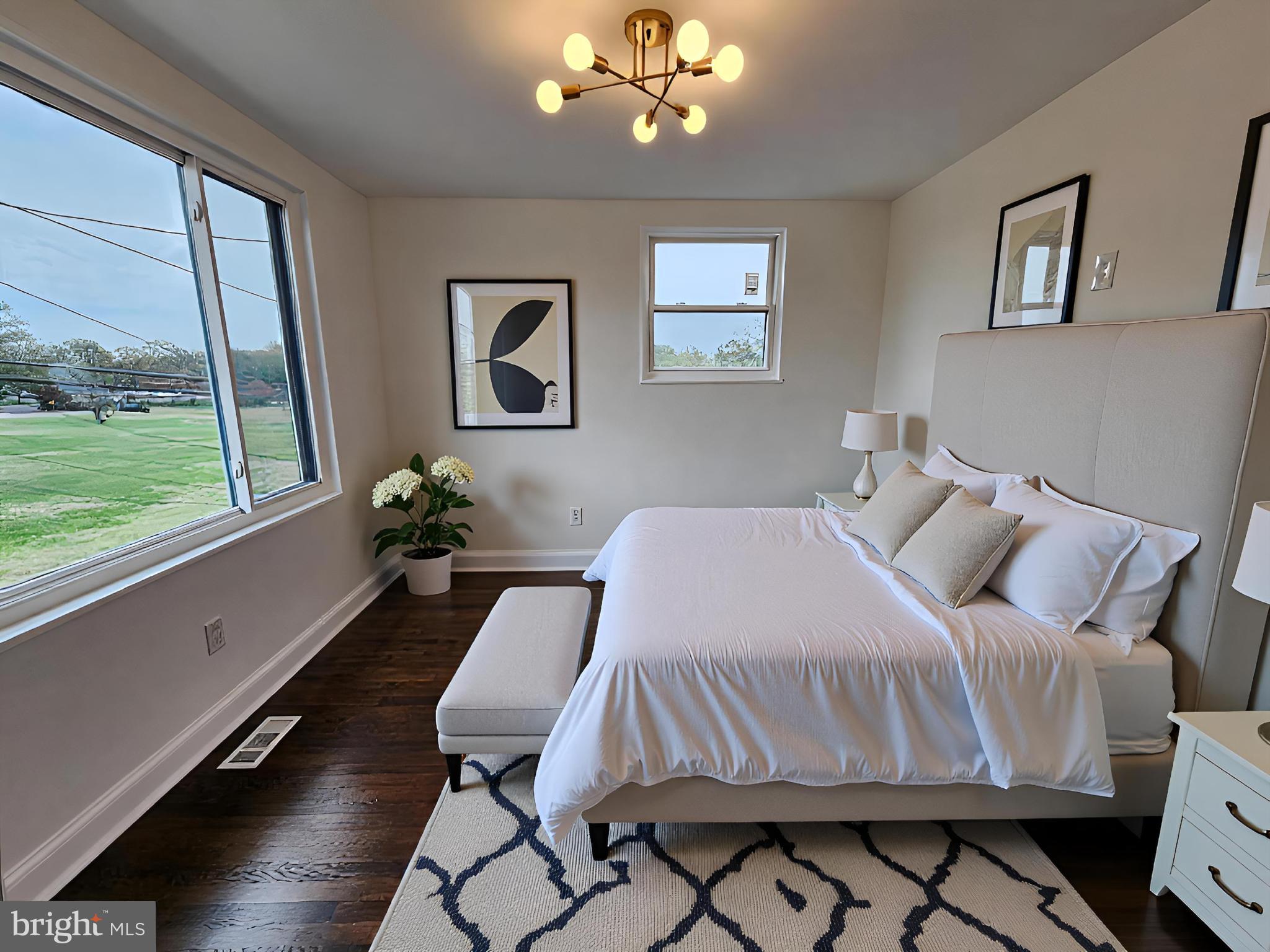 1261 Gallatin Street Northeast Washington, DC 20017 - Photo 27 of 60 a bed sitting in a bedroom next to a window