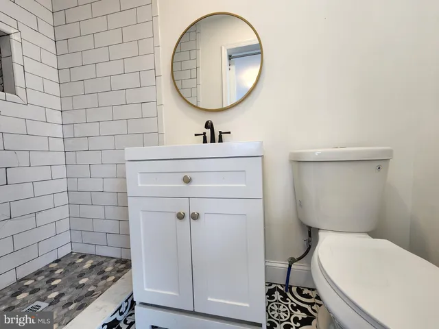 a view of a room with wooden floor and stairs