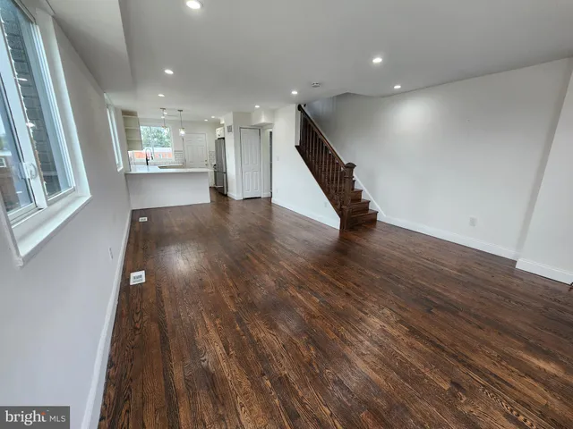 a bathroom with a sink toilet and a mirror